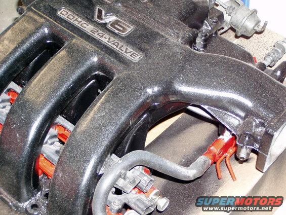 Close-up of V6 DOHC 24-valve engine intake manifold with fuel injectors visible