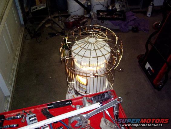 Radiant heater in a garage with a red toolbox in the foreground