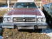 1973 Ford Ranchero - This Ford Ranchero has a distinctive grille and dual headlights, with a contrasting maroon hood.