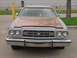 1973 Ford Ranchero - Front view of a 1973 Ford Ranchero with a two-tone paint scheme and chrome bumper.