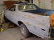 1973 Ford Ranchero - This Ford Ranchero is in a garage with its hood open, appearing to be in the process of restoration.
