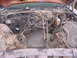 1973 Ford Ranchero - The engine bay is empty, showing the firewall and surrounding components with many wires exposed.