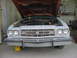 1973 Ford Ranchero - Front view of a light blue 1973 Ford Ranchero with its hood open, parked in a garage.