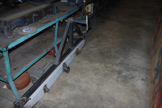 Custom rear bumper fabrication in progress, showing metal frame and grey bumper section