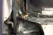 1968 Ford Mustang - Close-up of damaged vehicle frame showing rust and a part number tag.