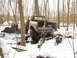 1979 Ford Bronco - Off-road truck with lifted suspension stuck in mud and snow during winter outing.