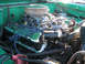 1975 Ford Bronco - Close-up view of the engine bay, highlighting chrome valve covers and an aftermarket air filter.