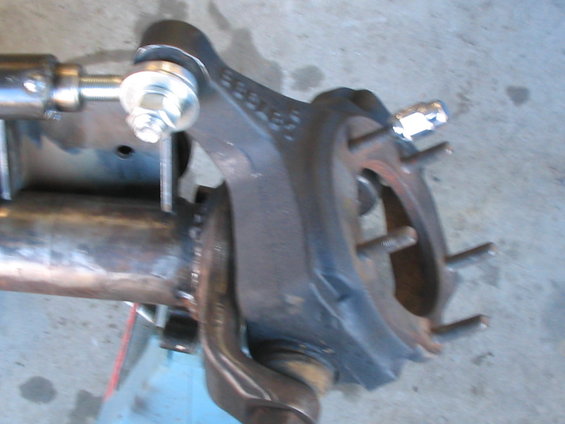Dana 44 axle housing and knuckle assembly with bolts and linkage