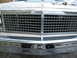 1985 Ford Crown Victoria LTD - The front grille and bumper of a 1985 Ford Crown Victoria LTD are visible in this close-up photo.