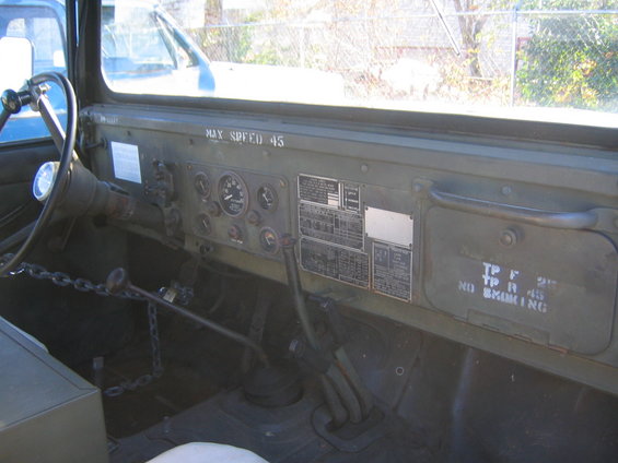 Military truck interior with gauges and 'MAX SPEED 45' label