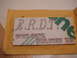 1989 Ford Escort - A document the text 'T.R.D.J.' and a stylized green dragon illustration.
