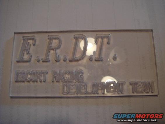 Embossed sign reading E.R.D.T. ESCORT RACING DEVELOPMENT TEAM