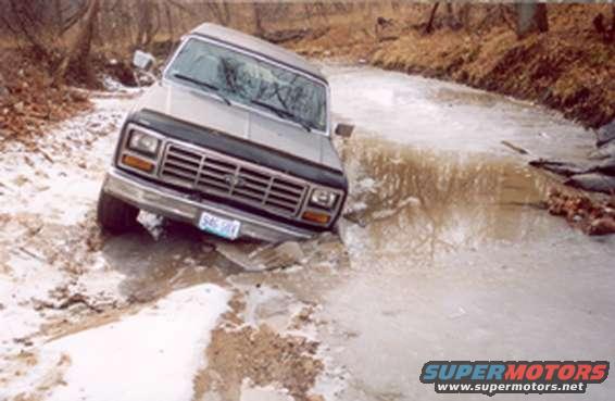 Ford Bronco stuck in muddy water, front end submerged
