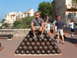 1994 Jeep YJ - A man poses for a photo atop a large pyramid of cannonballs, with people and buildings in the background.