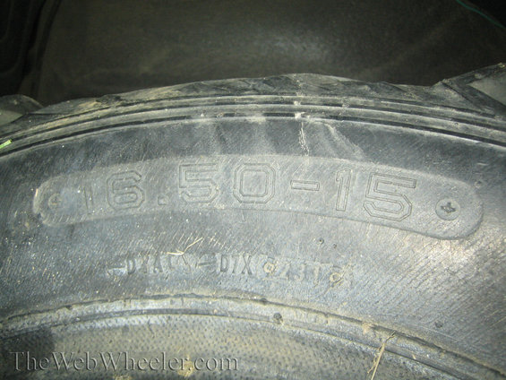 Tire sidewall showing size 16.50-15 and other markings