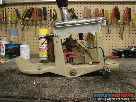 Automatic transmission shifter assembly with chrome handle and beige plastic housing