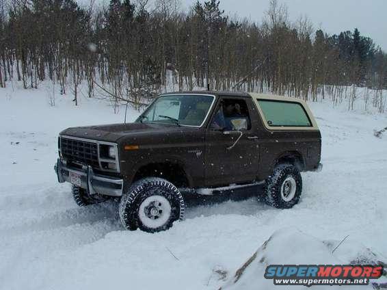 1980 Ford Bronco driving in snow
