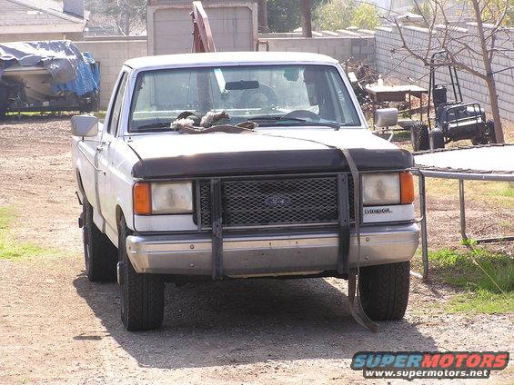 88-ford-f250-diesel.jpg pic of my truck (after towing it home after it crapped out on me) its a tow strap on the hood