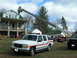 1989 Ford Bronco - Emergency vehicles including a ladder truck and GMC SUV are on scene near a house.