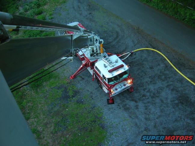 Fire truck with hose extended, aerial view