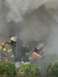 1989 Ford Bronco - Firefighters work through thick smoke at a scene.