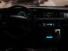 1992 Ford Crown Victoria - The interior of a car shows a dashboard with illuminated gauges and an aftermarket stereo system.