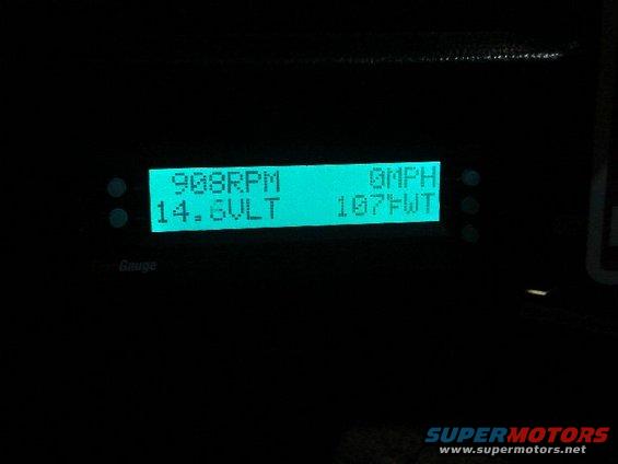 Digital dashboard display showing 908 RPM, 14.6V, 0 MPH, 107F