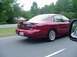 1998 Ford Taurus - This 1998 Ford Taurus is seen from the rear as it drives down a road.