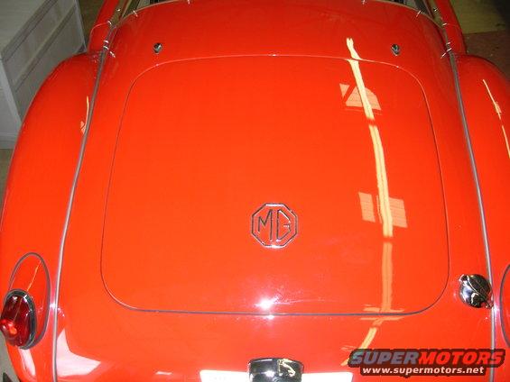 The flash is washing out some of the color.  The car is actually very red.
