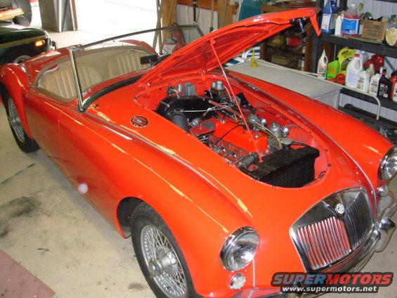 01rhf.jpg The flash is washing out some of the color. The car is actually very red.