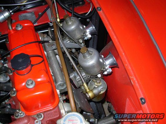 The flash is washing out some of the color. The car is actually very red.