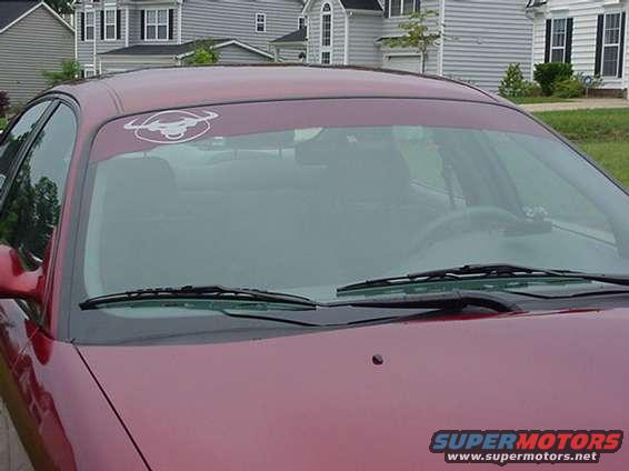 1998 Ford Taurus interior showing dashboard and windshield with a sunstrip decal