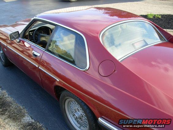 Red 1992 Jaguar XJ-S coupe, 3/4 front view showing side profile and roofline