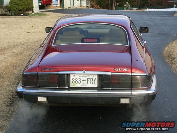 Rear view of a red 1992 Jaguar XJ-S V12 with Tennessee license plate 883-FRY