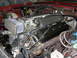 1992 Jaguar XJ-S - Close-up view of an engine bay, a prominent air filter and a valve cover with 'CORVETTE' text.