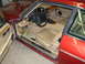 1992 Jaguar XJ-S - Interior view of a red Jaguar XJ-S, showing tan leather seats and dashboard details.