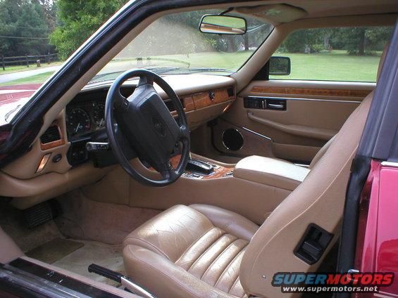 Tan leather interior of a 1992 Jaguar XJ-S, showing dashboard and seats