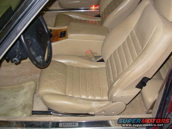 Interior of a 1992 Jaguar XJ-S showing tan leather seats, wood trim, and steering wheel
