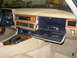 1992 Jaguar XJ-S - The interior of a 1992 Jaguar XJ-S features wood trim and an open glove box.