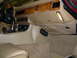 1992 Jaguar XJ-S - The dashboard and center console of a classic car are shown, wood grain accents and beige upholstery.