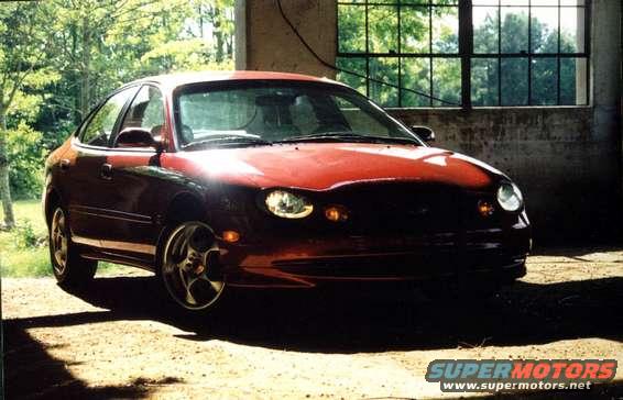 Red 1998 Ford Taurus 3q-front view
