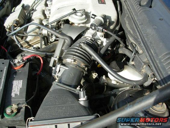 Engine bay with battery and air intake system