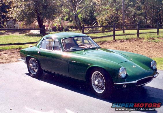 Green coupe with wire wheels, front three-quarter view