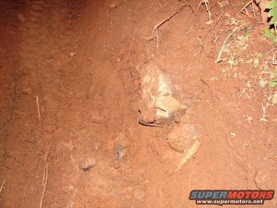 The rock that caused the cut.  It had a sharp edge and I never saw it sticking out the side of the rut.