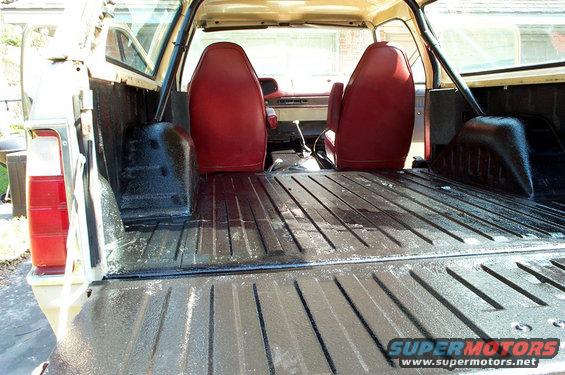 1978 Dodge Power Ram interior showing red seats and truck bed with spray-on liner
