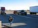 1952 Ford Pickup - A dark blue pickup truck tows a trailer, with other trucks in the background.