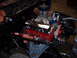1984 Ford Bronco - Close-up view of a modified V8 engine, highlighting its performance components and custom wiring.