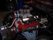 1984 Ford Bronco - This is a close-up view of a modified V8 engine, likely undergoing restoration or customization.