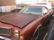 1979 Ford Ranchero - This 1979 Ford Ranchero, seen from the front three-quarter angle, is a maroon pickup truck with a white camper shell.