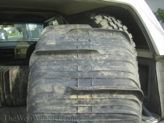 Paddle tires stacked inside a vehicle's cargo area